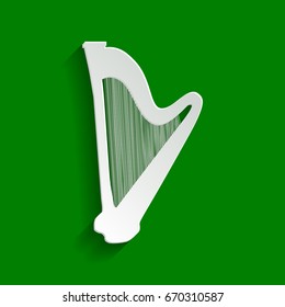 Musical instrument harp sign. Vector. Paper whitish icon with soft shadow on green background.