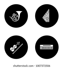 Musical instruments glyph icons set. French horn, gusli, violin, mellotron. Vector white silhouettes illustrations in black circles