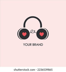 Musical logo in the form of headphones with a heart.