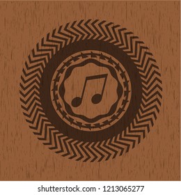 musical note icon inside badge with wood background