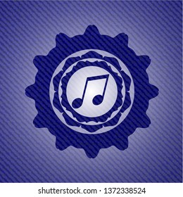 musical note icon inside badge with denim background