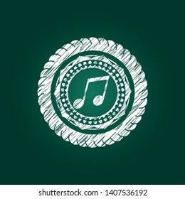 musical note icon inside chalk emblem written on a blackboard