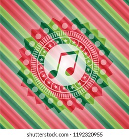 musical note icon inside christmas colors emblem.