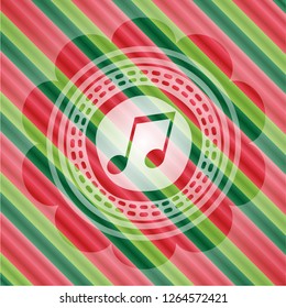 musical note icon inside christmas colors badge.