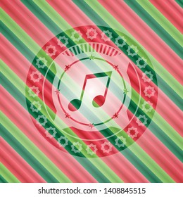 musical note icon inside christmas colors style emblem.
