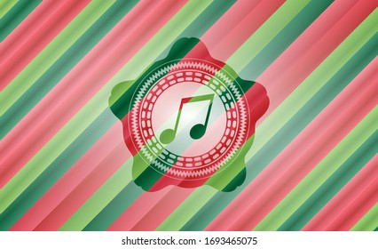 musical note icon inside christmas colors badge.