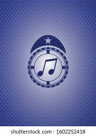 musical note icon inside denim background
