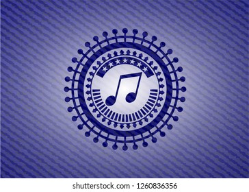 musical note icon inside emblem with denim texture