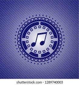musical note icon inside emblem with jean texture