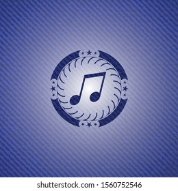 musical note icon inside emblem with jean background