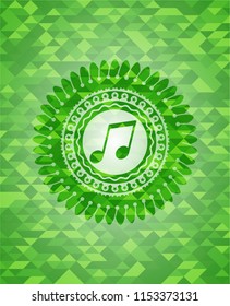 musical note icon inside green mosaic emblem