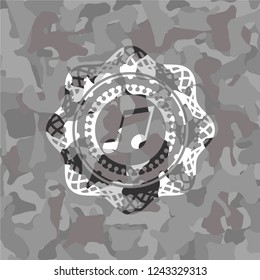 musical note icon inside grey camo texture