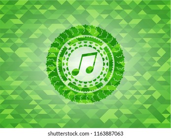 musical note icon inside realistic green mosaic emblem