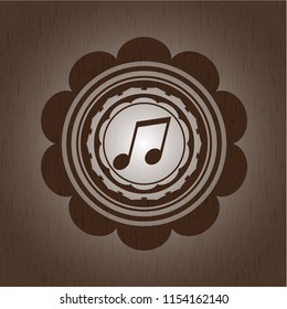 musical note icon inside retro style wooden emblem