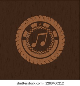 musical note icon inside retro wooden emblem