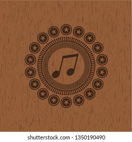 musical note icon inside retro wooden emblem