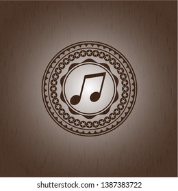 musical note icon inside retro style wooden emblem