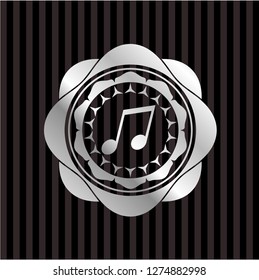musical note icon inside silver emblem or badge