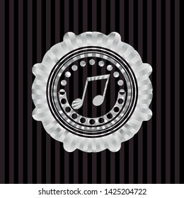 musical note icon inside silver badge or emblem