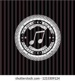 musical note icon inside silvery emblem