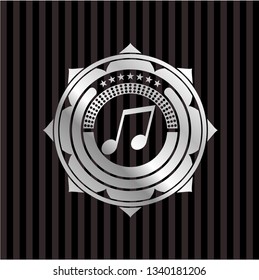 musical note icon inside silvery emblem