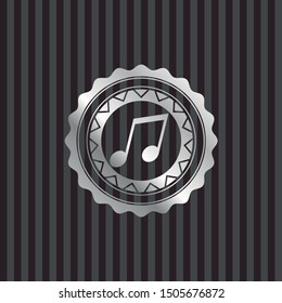 musical note icon inside silvery emblem