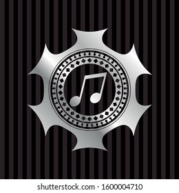 musical note icon inside silvery emblem