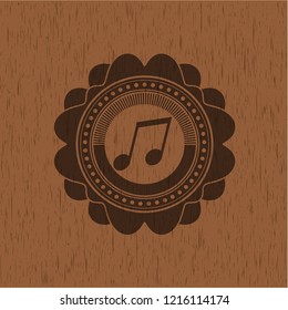 musical note icon inside wood emblem