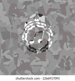 musical note icon on grey camouflage texture