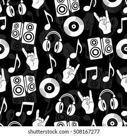 Musical vector background, music accessories seamless pattern. Silhouette drawing black and white music headphones, plate, loudspeakers, notes and fingers gesture goat. Monochrome illustration