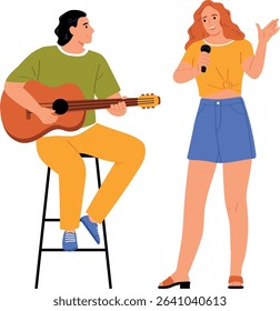 Musician plays guitar while a woman sings into a microphone together happily
