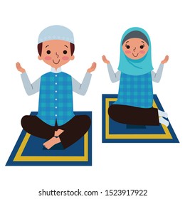 A muslim boy and girl praying together on a prayer rug