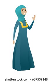 Muslim business woman waving her hand. Full length of business woman waving her hand. Business woman making greeting gesture - waving hand. Vector cartoon illustration isolated on white background