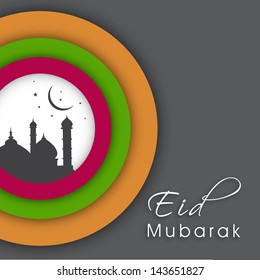 Muslim community festival Eid Mubarak background with view of mosque.