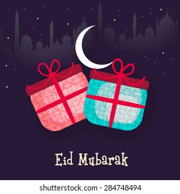 Muslim community festival, Eid Mubarak celebration with floral design decorated gifts in night view on Mosque silhouette background.