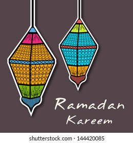 Muslim community holy month of Ramadan Kareem background with hanging intricate arabic lanterns on abstract background.