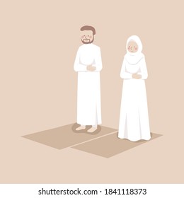 Muslim couple practice pray together on the prayer mat