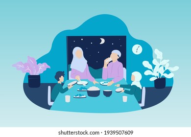 Muslim Familiy having dinner together. Break the fast in month of ramadhan.