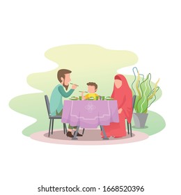 a Muslim family eating together, father gave the example of eating with the right hand and praying before starting eat