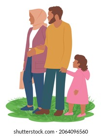 A Muslim family is walking in the park on the grass with a girl holding her father hand. Woman in hijab. Isolated on white. Couple in love. Relationship in happy traditional family. 