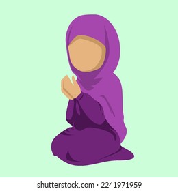 Muslim girl in hijab is praying