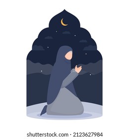 Muslim girl praying in the night of Ramadan