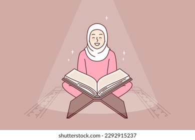 Muslim girl reads holy book quran turning to god allah sits in mosque or religious place for prayer. Positive woman in hijab studying arabic quran getting islamic traditional education