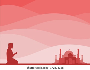 muslim kneeling for a pray, with a mosque background