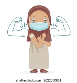 Muslim little girl in face mask gesturing thumb up. Open shoulders for vaccination after receiving covid-19 vaccine injection.Kid approving of coronavirus immunization.