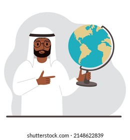 A muslim man holds a globe in his hand and points his finger at it. The concept of education, teacher, world conquest, ecology. Vector flat illustration