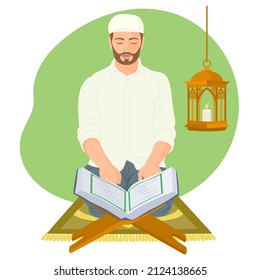 Muslim man with holy book Quran and praying