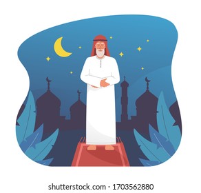 Muslim Man Praying At Night With Silhouette Of Mosque