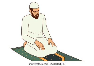 Muslim man praying on a prayer matte. 