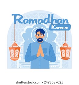 Muslim man saying Ramadan greetings. Stand with hanging lantern decoration. Ramadan Kareem concept. Flat vector illustration.